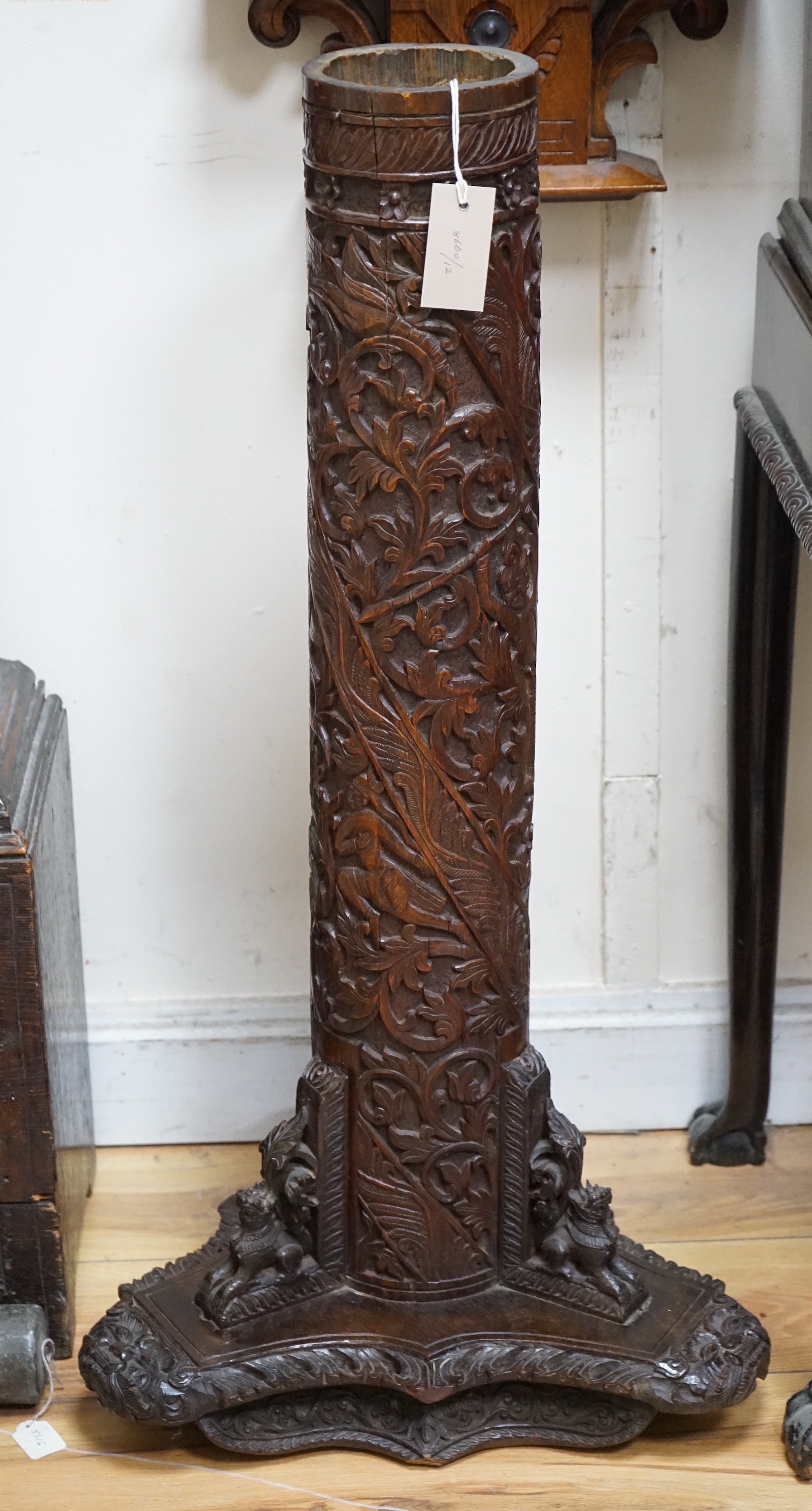 A late 19th century Burmese carved bamboo and wood stand, 84.5 cm high